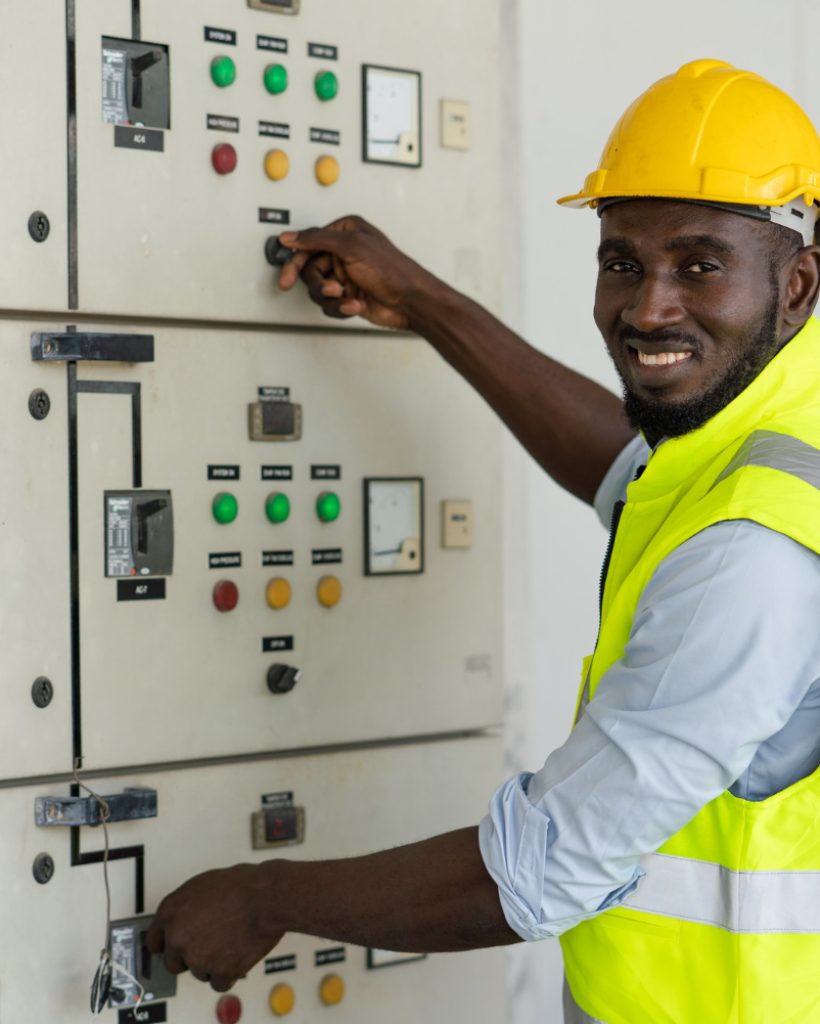 african-electrical-worker-open-power-circuit-breaker-voltage-switch-warehouse-factory